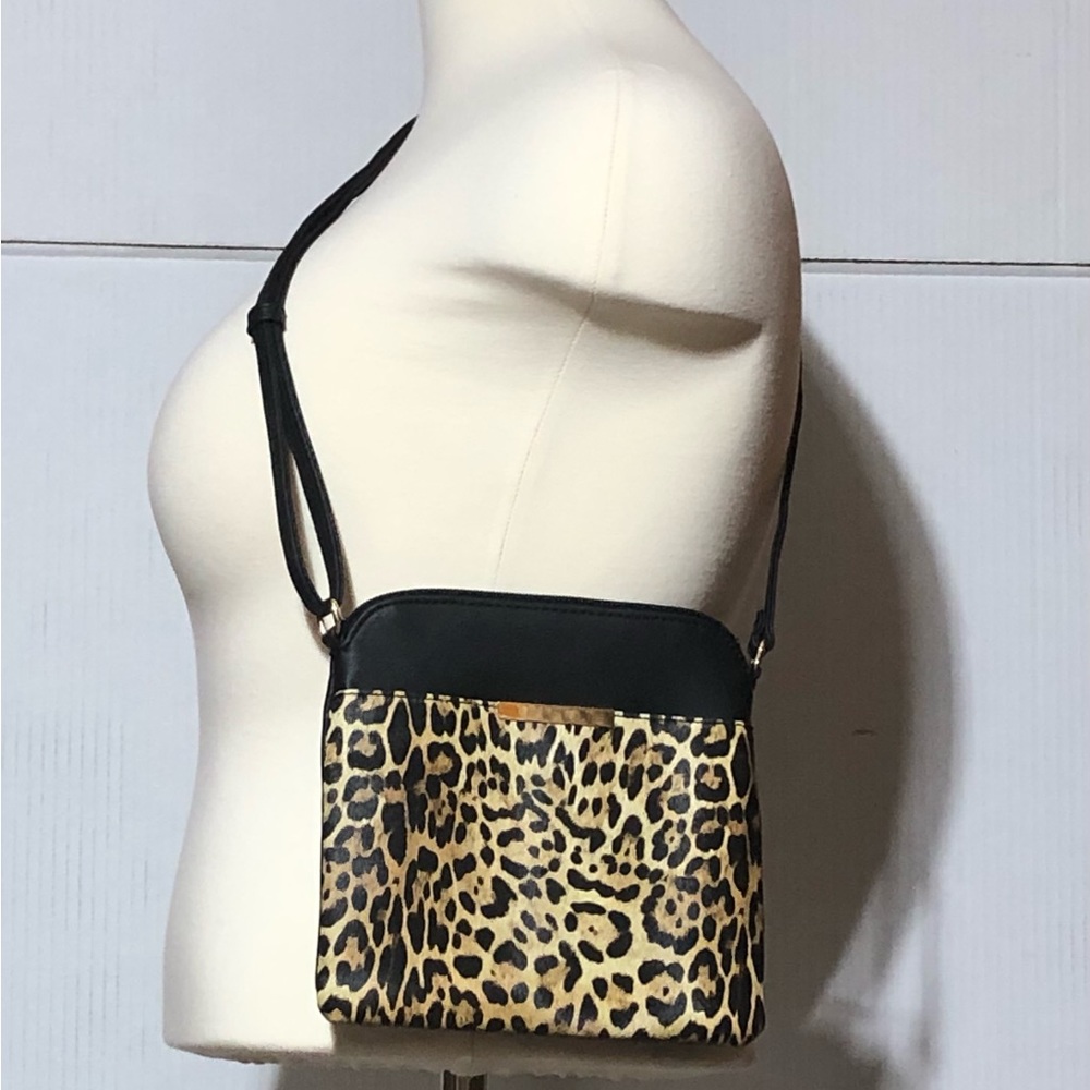 No name faux animal print leather cross body. Measures 9”x9 never carried. NWOT